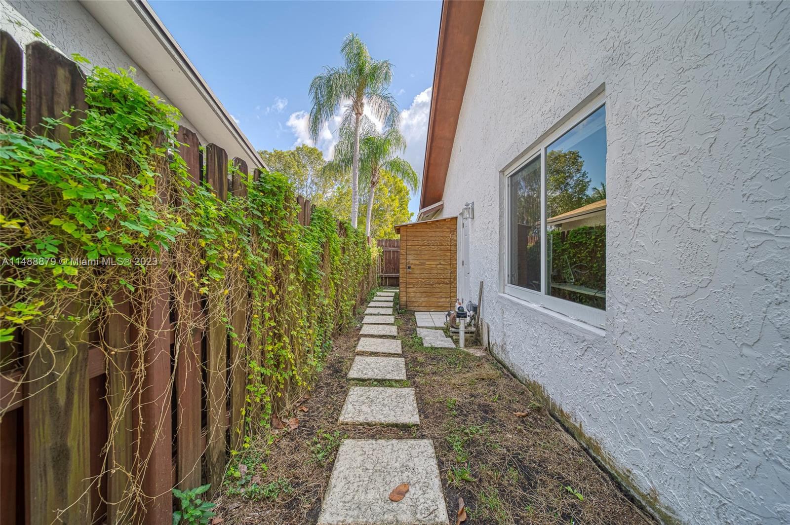 9904 Southwest 133rd Court Miami, FL 33186 - Photo 39 of 43 a house with a yard and potted plants
