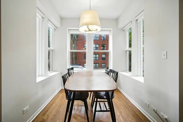 a table and chairs in a small room