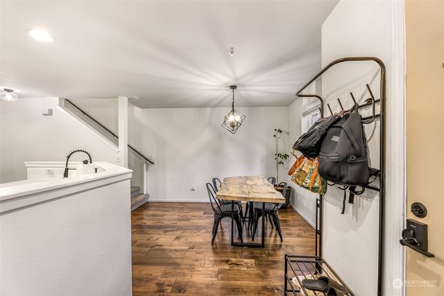 a kitchen with a refrigerator a stove top oven a sink and dishwasher