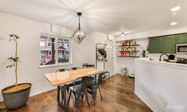 a kitchen with a refrigerator and a sink