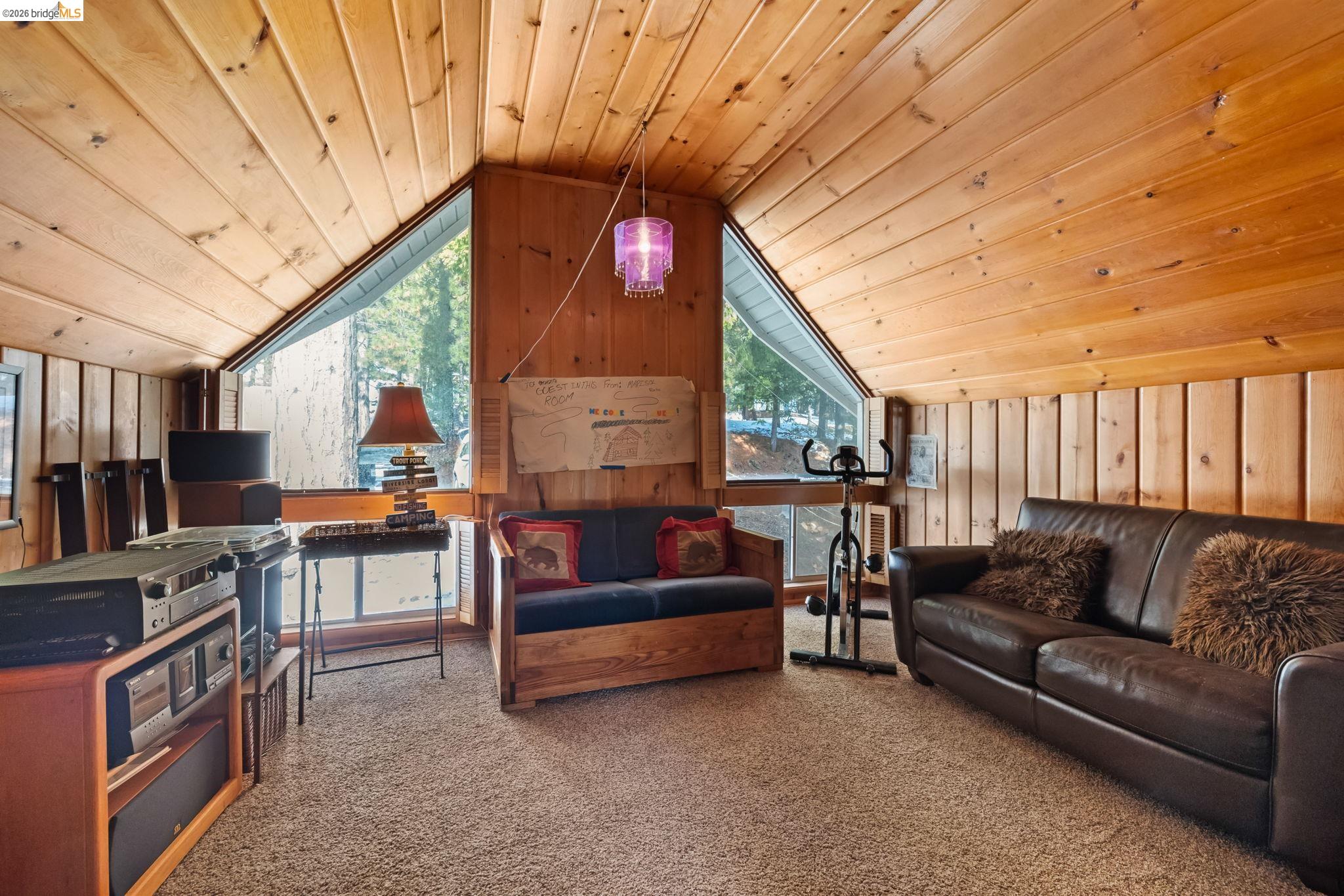 26039 Long Barn Road Long Barn, CA 95335 - Photo 3 of 27 Living room with wooden ceiling, wood walls, carpet flooring, and vaulted ceiling