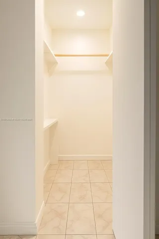 a bathroom with a toilet and a shower curtain