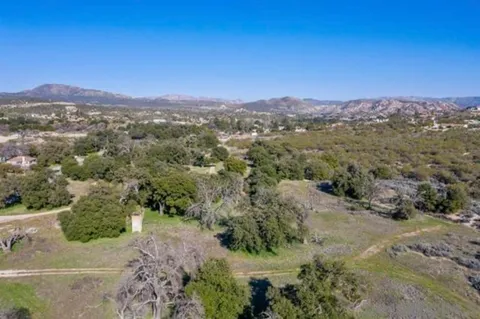 a view of a city with mountains in the background