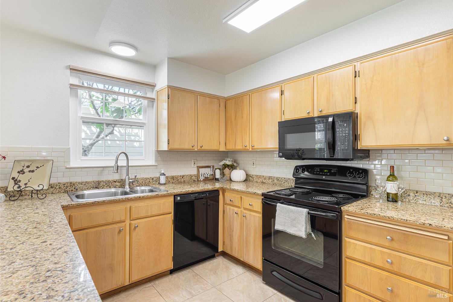 2773 Elks Way Napa, CA 94558 - Photo 14 of 39 a kitchen with a sink stove top oven and cabinets