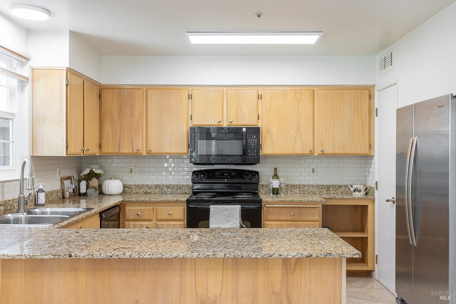 2773 Elks Way Napa, CA 94558 - Photo 15 of 39 a kitchen with a stove a sink and a refrigerator