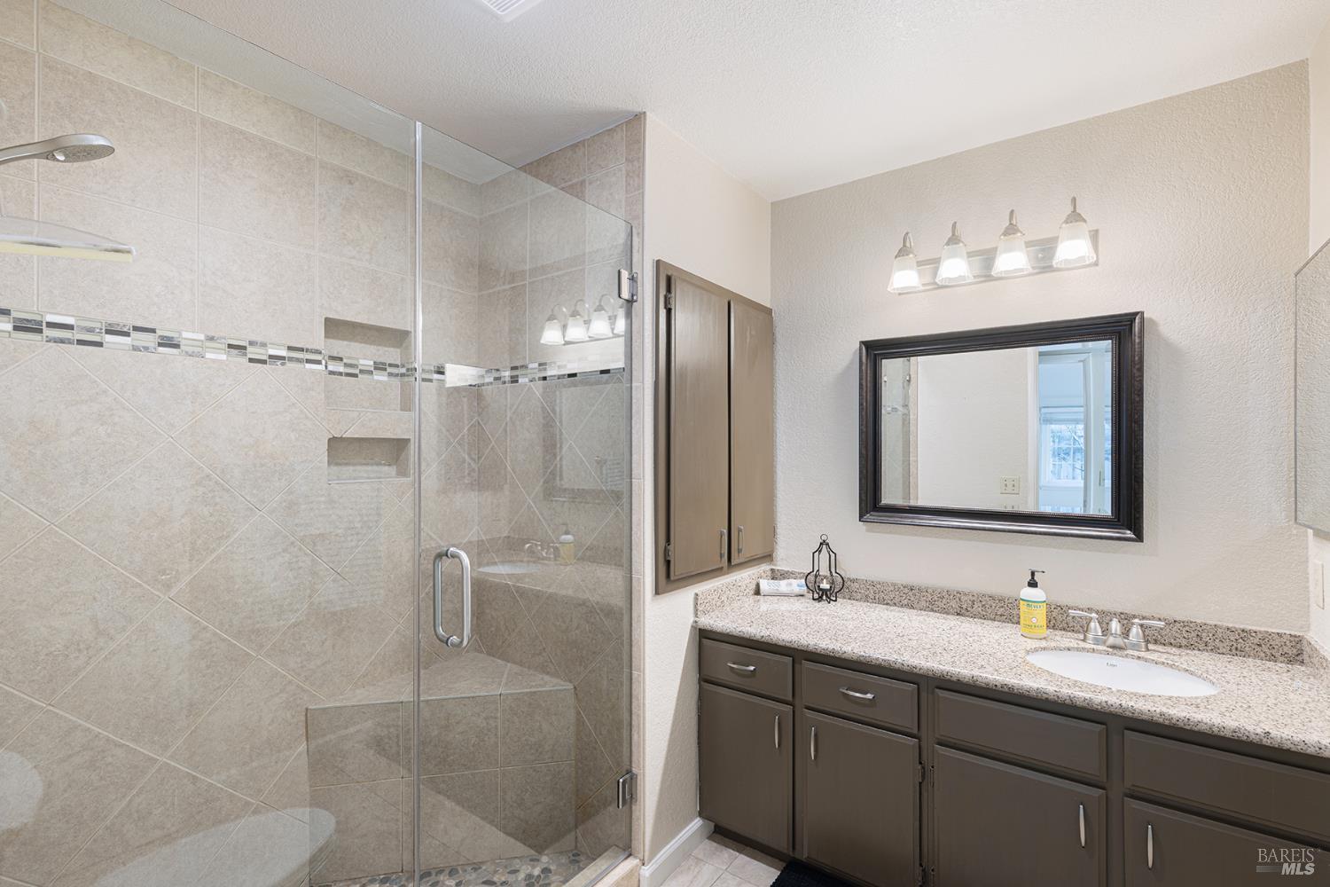 2773 Elks Way Napa, CA 94558 - Photo 25 of 39 a bathroom with a double vanity sink mirror and double