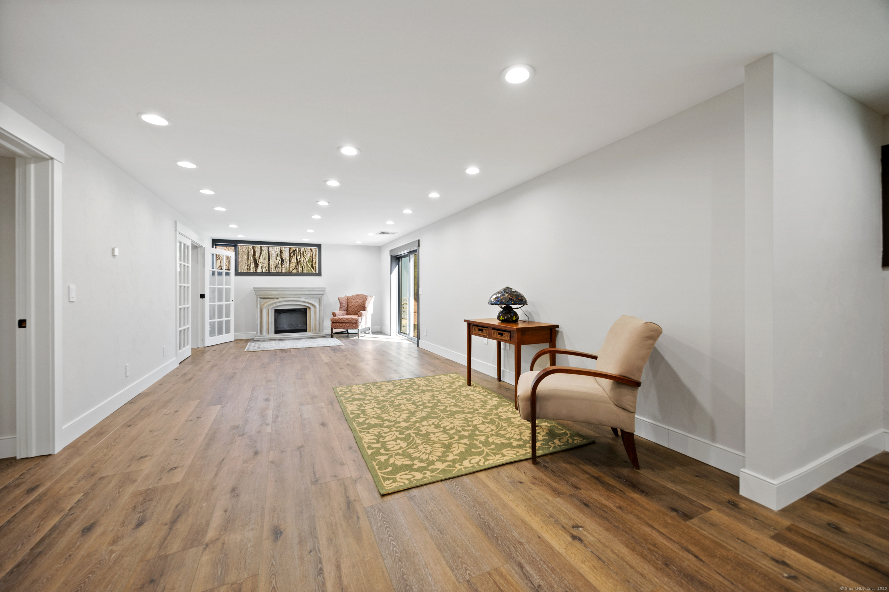 187 Sherbrook Drive Goshen, CT 06756 - Photo 33 of 39 a living room with furniture and a rug