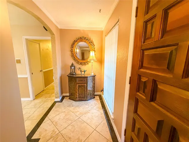 a view of a bathroom with mirror and door