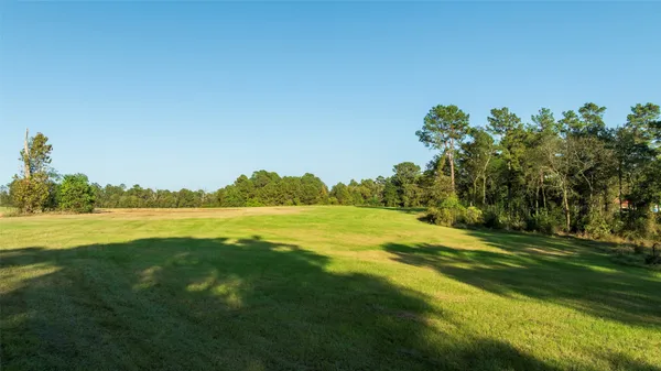 a view of a lake with a big yard