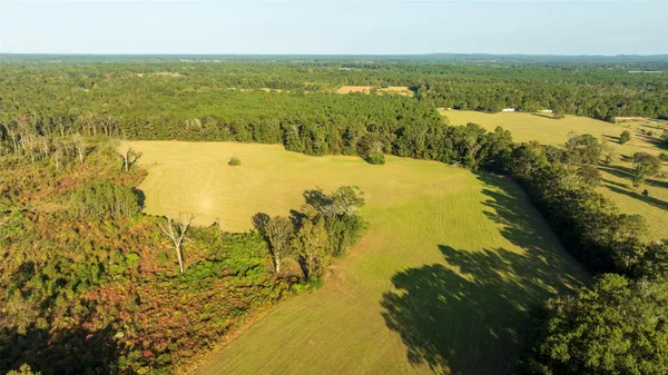 a view of a lake with a yard