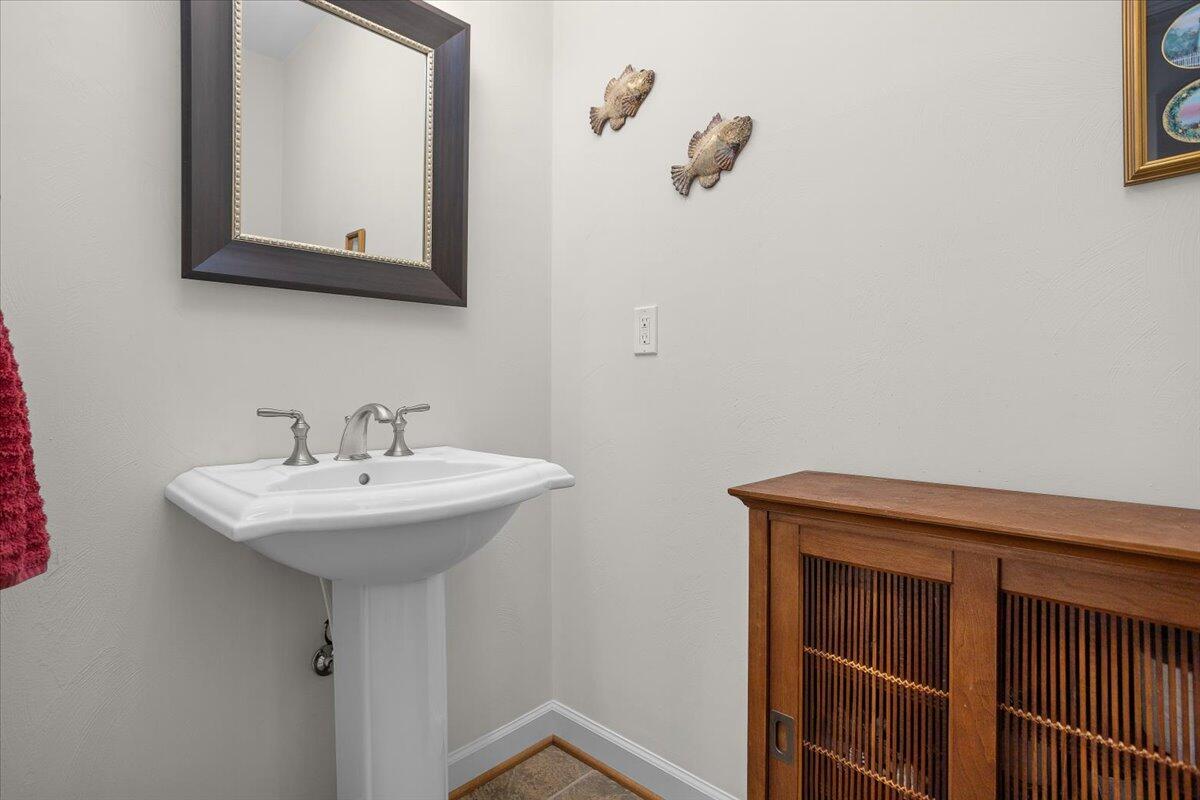 360 Maple Ridge Lane Fincastle, VA 24090 - Photo 19 of 77 a bathroom with a sink and a mirror