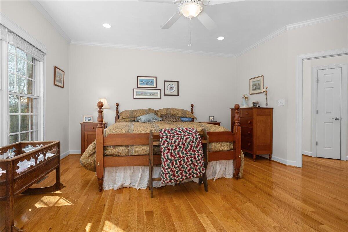 360 Maple Ridge Lane Fincastle, VA 24090 - Photo 33 of 77 a bedroom with a bed and wooden floor