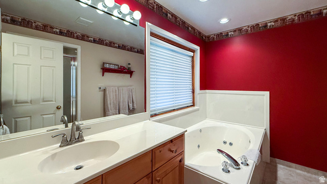 143 East Chestnut Street Helper, UT 84526 - Photo 11 of 35 Full bathroom featuring a whirlpool tub and vanity