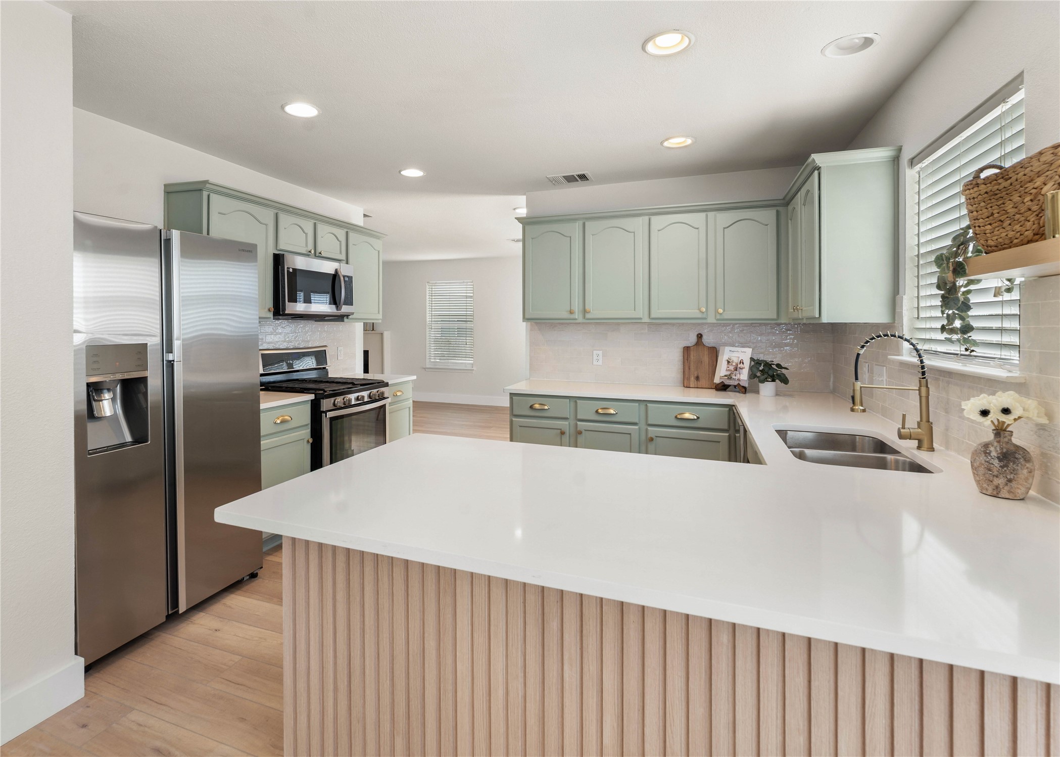 183 Musgrav Kyle, TX 78640 - Photo 17 of 24 a kitchen with stainless steel appliances a refrigerator sink and wooden cabinets