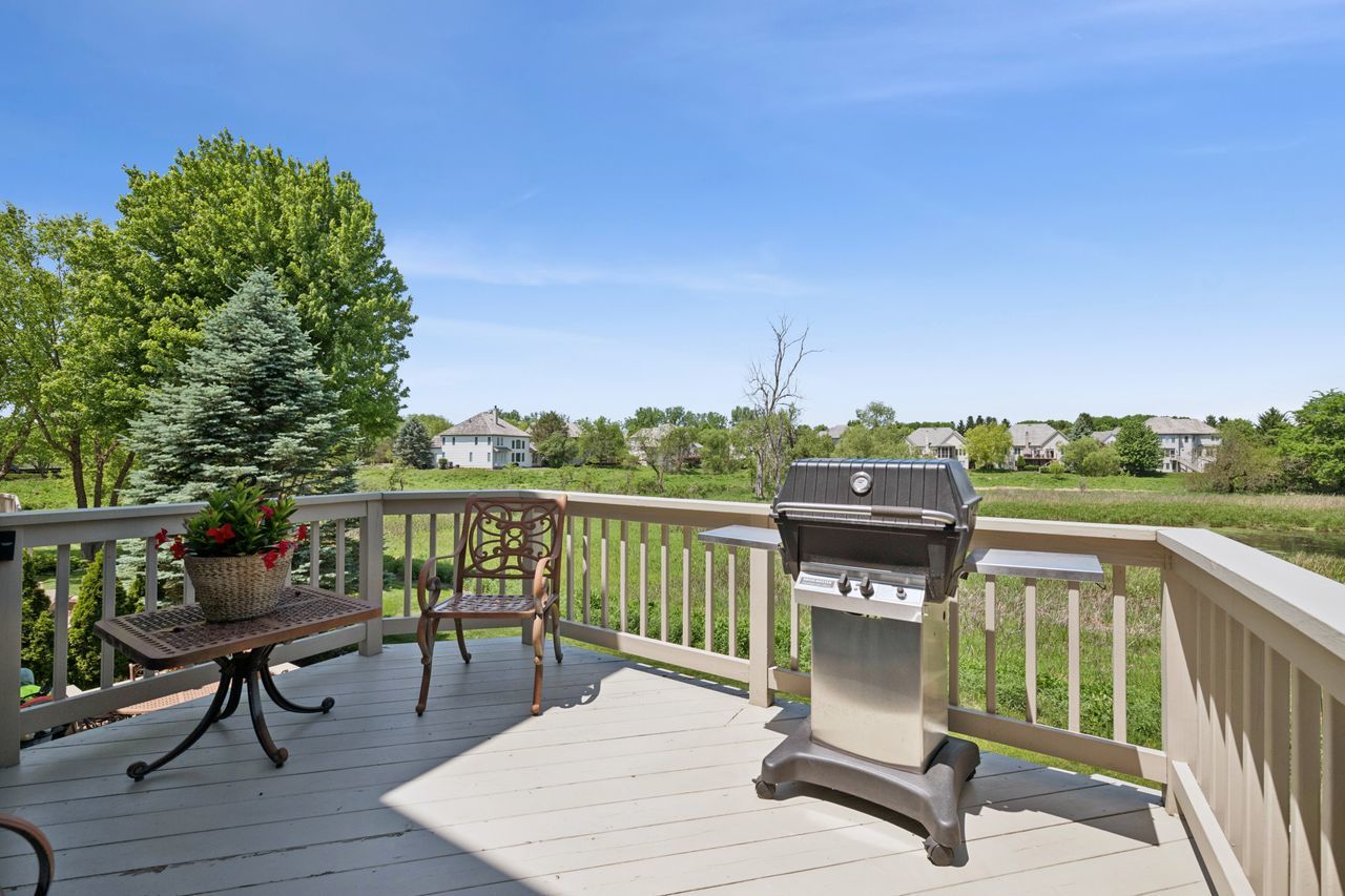 1029 Ridgeview Drive Inverness, IL 60010 - Photo 52 of 58 a balcony with wooden floor table and chairs