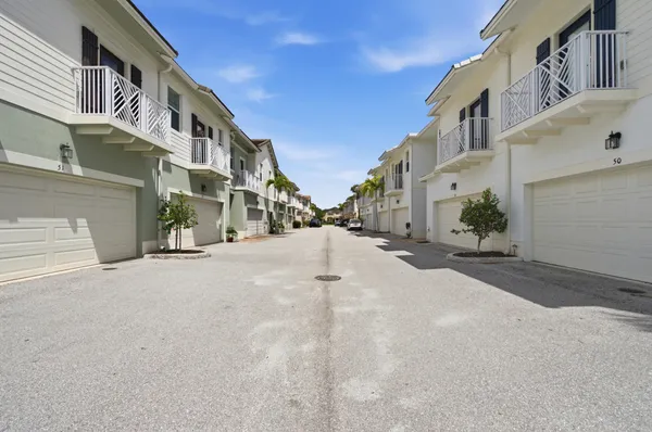 a view of a street with tall buildings
