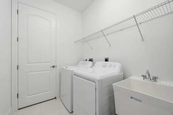 a bed room with a bed and a chair