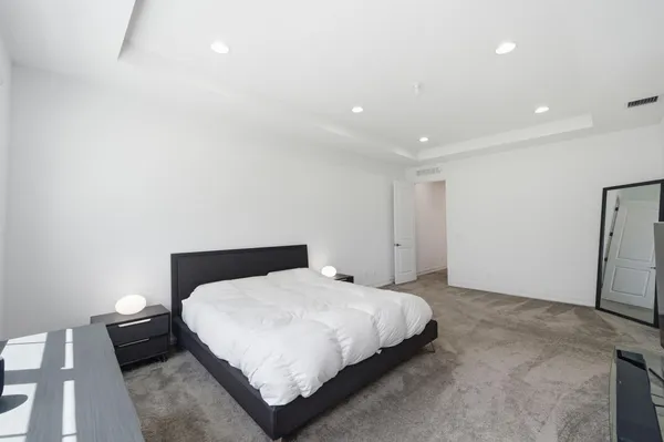 a view of walk in closet with clothes