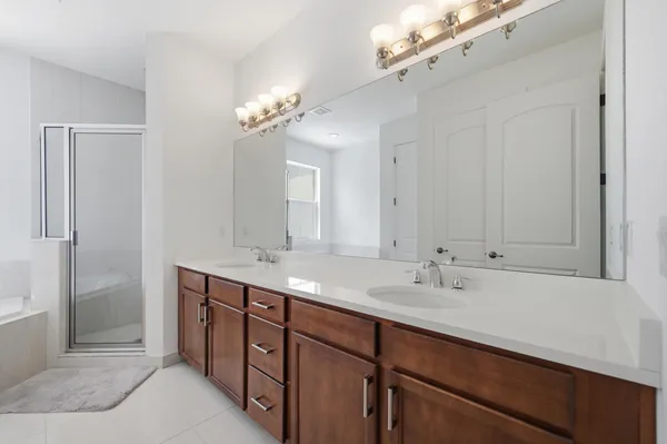 a bathroom with a tub and shower