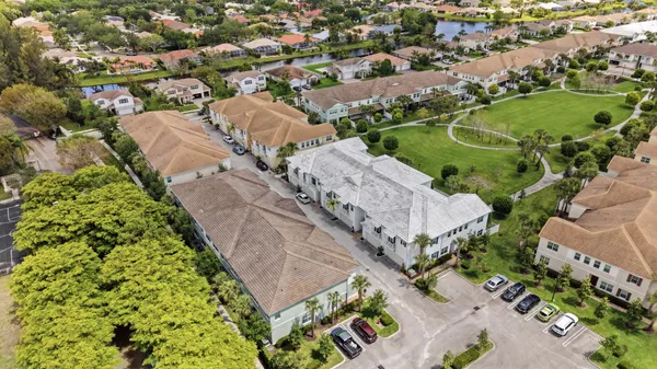 an aerial view of residential houses with outdoor space