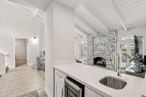 a kitchen with a sink a stove and a refrigerator