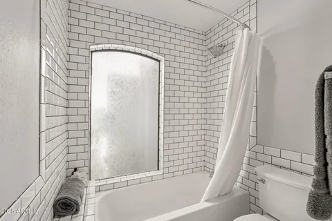 a view of a patio with a table and chairs