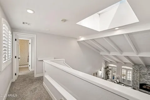 a spacious bedroom with a bed and a window