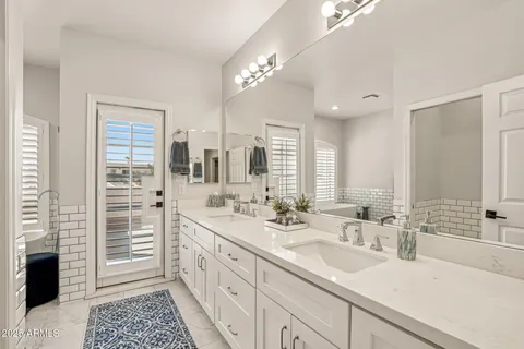 a view of a front door and potted plants