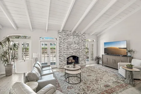a living room with furniture and a rug