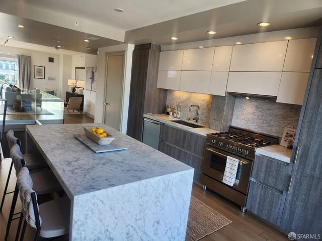 a kitchen with a stove and a sink