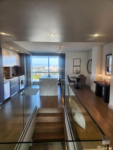 a lobby with furniture and a potted plant