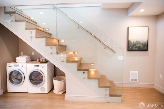 a utility room with dryer and washer