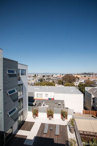 a view of a balcony with city view