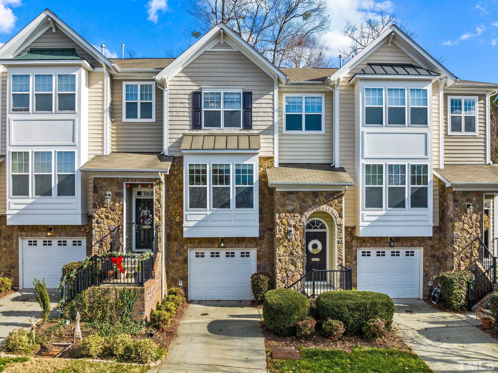 6104 Braidwood Court Raleigh, NC 27612 - Photo 1 of 31 a front view of a house with a yard