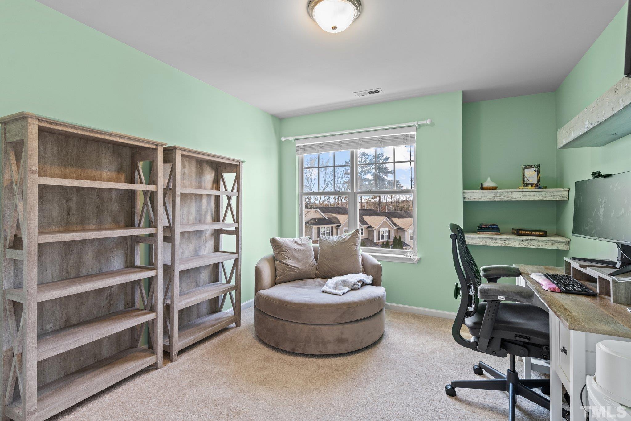 6104 Braidwood Court Raleigh, NC 27612 - Photo 19 of 31 a work room with furniture and a window