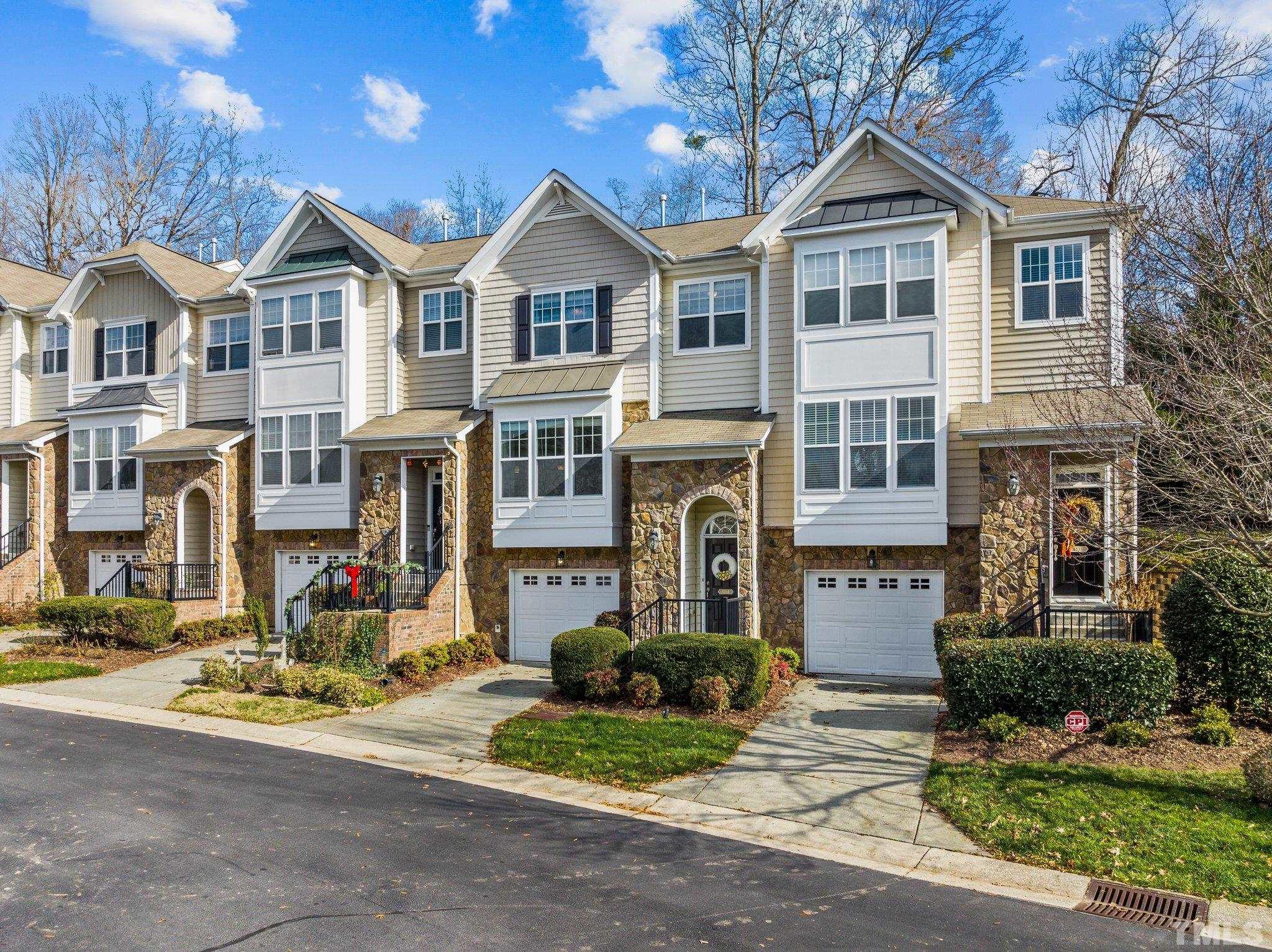 6104 Braidwood Court Raleigh, NC 27612 - Photo 2 of 31 a front view of a house with a yard