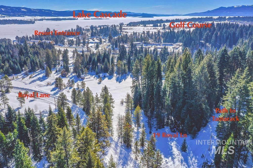 19 Royal Lane Donnelly, ID 83615 - Photo 2 of 8 Snowy aerial view featuring a mountain view and a view of trees