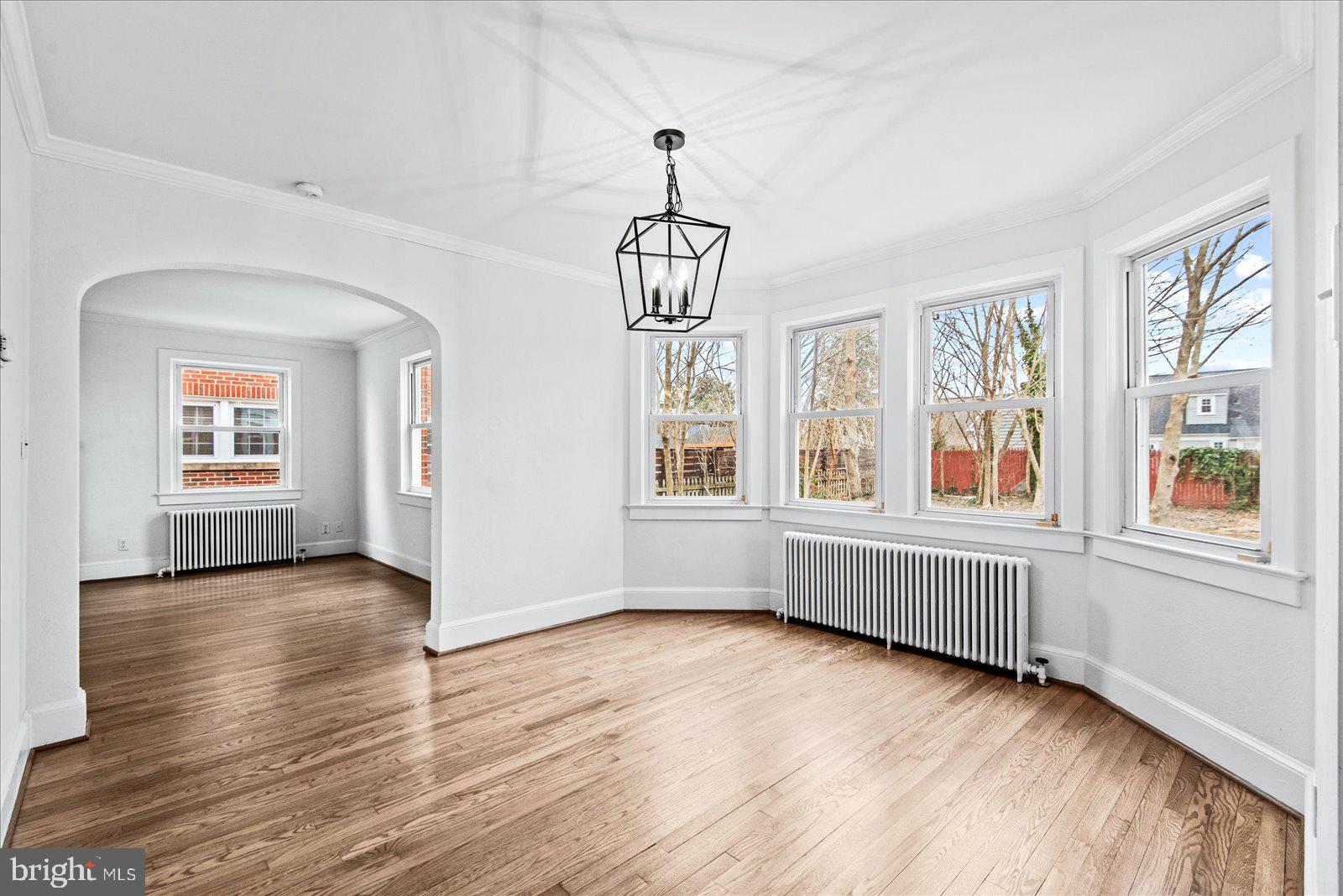 1312 Rowe Street Fredericksburg, VA 22401 - Photo 13 of 45 a view of an empty room with wooden floor and windows