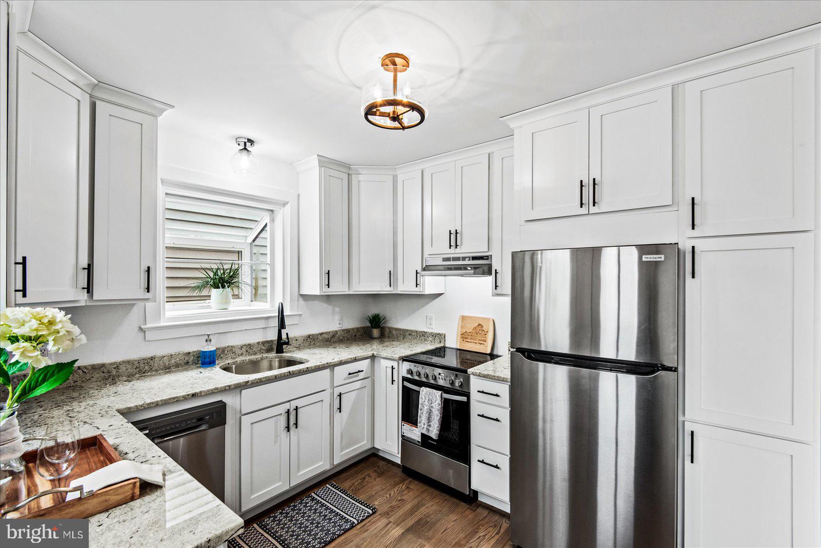 1312 Rowe Street Fredericksburg, VA 22401 - Photo 15 of 45 a kitchen with a refrigerator and a sink