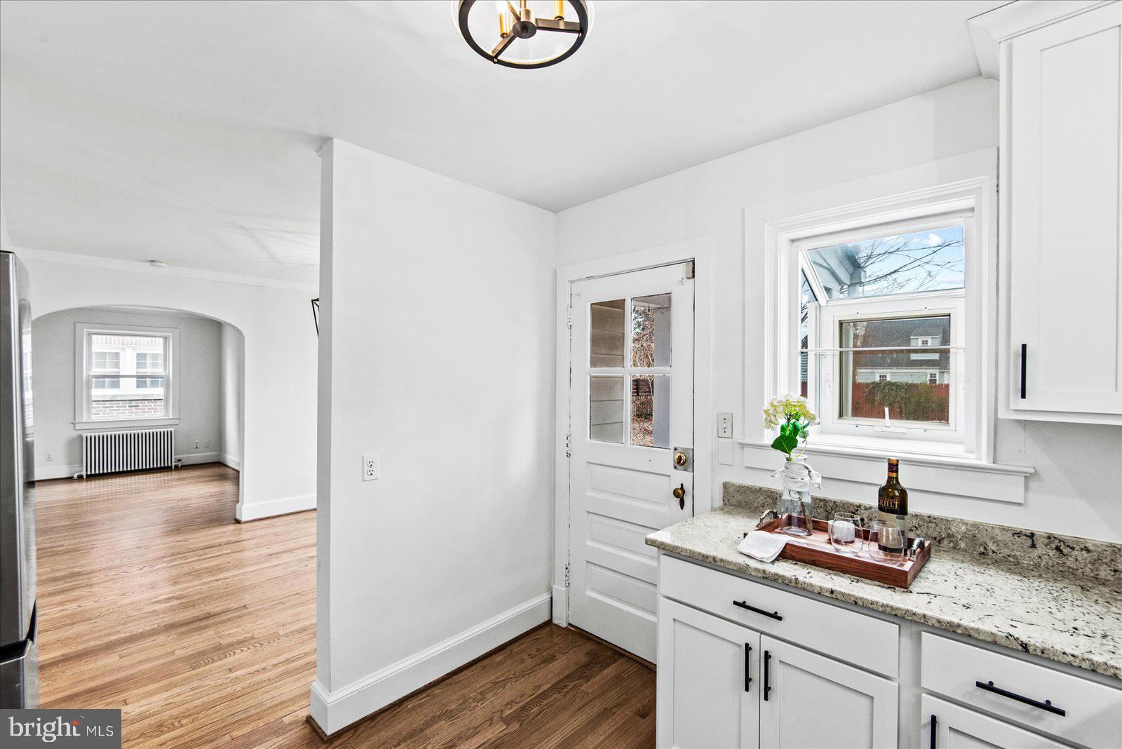 1312 Rowe Street Fredericksburg, VA 22401 - Photo 16 of 45 a kitchen with a sink and wooden floor