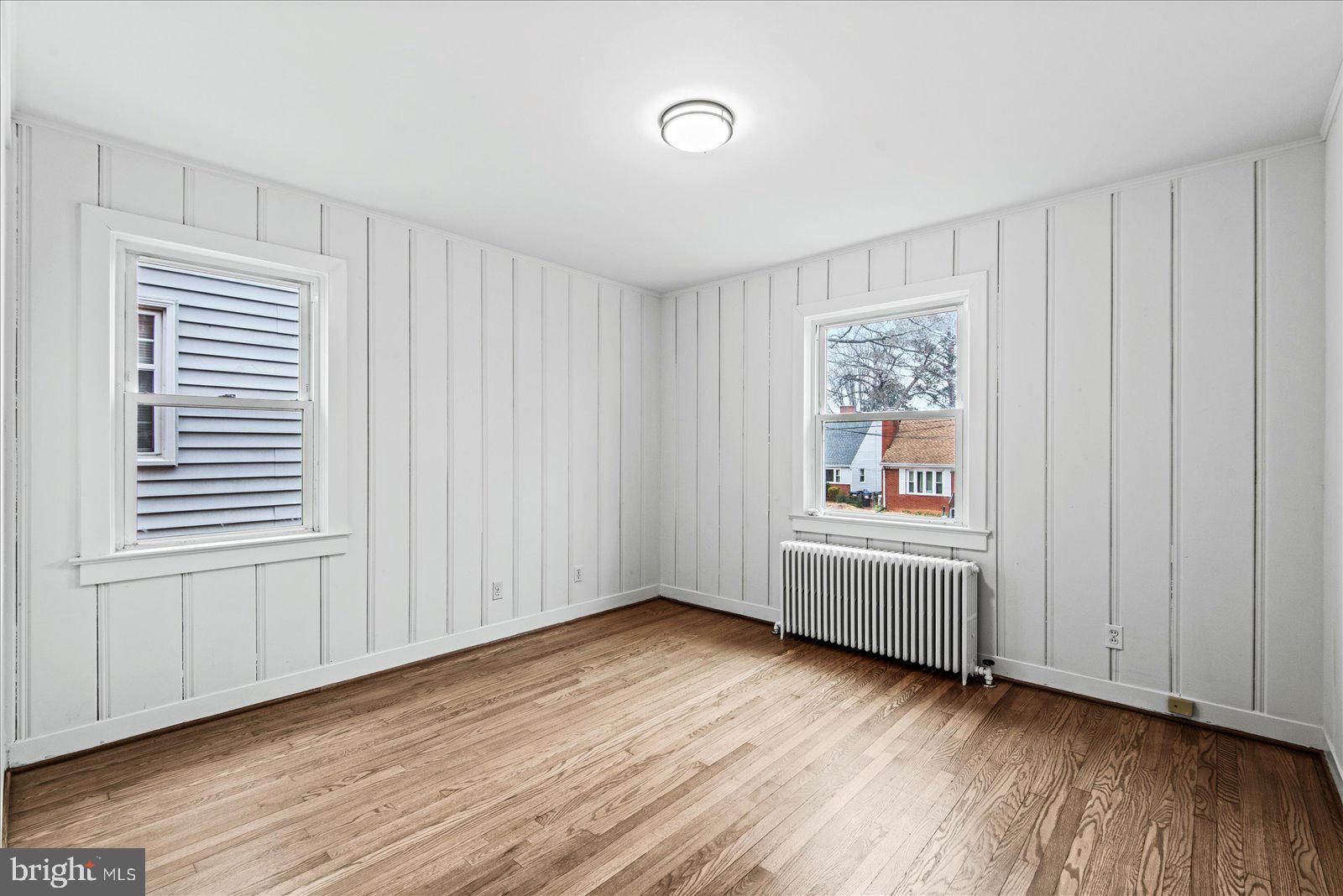 1312 Rowe Street Fredericksburg, VA 22401 - Photo 18 of 45 an empty room with wooden floor and windows