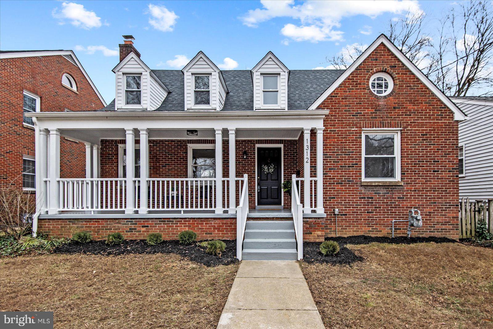 1312 Rowe Street Fredericksburg, VA 22401 - Photo 2 of 45 a front view of a house with a yard