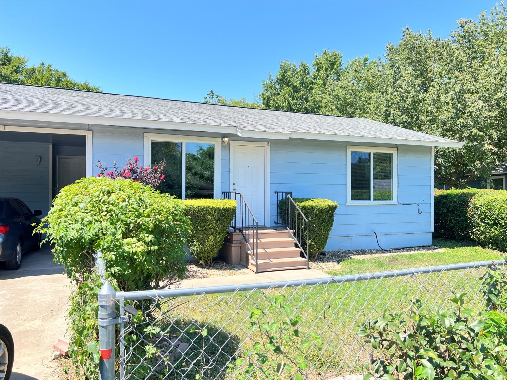 3112 Govalle Avenue, Unit B Austin, TX 78702 - Photo 2 of 7 a front view of a house with garden