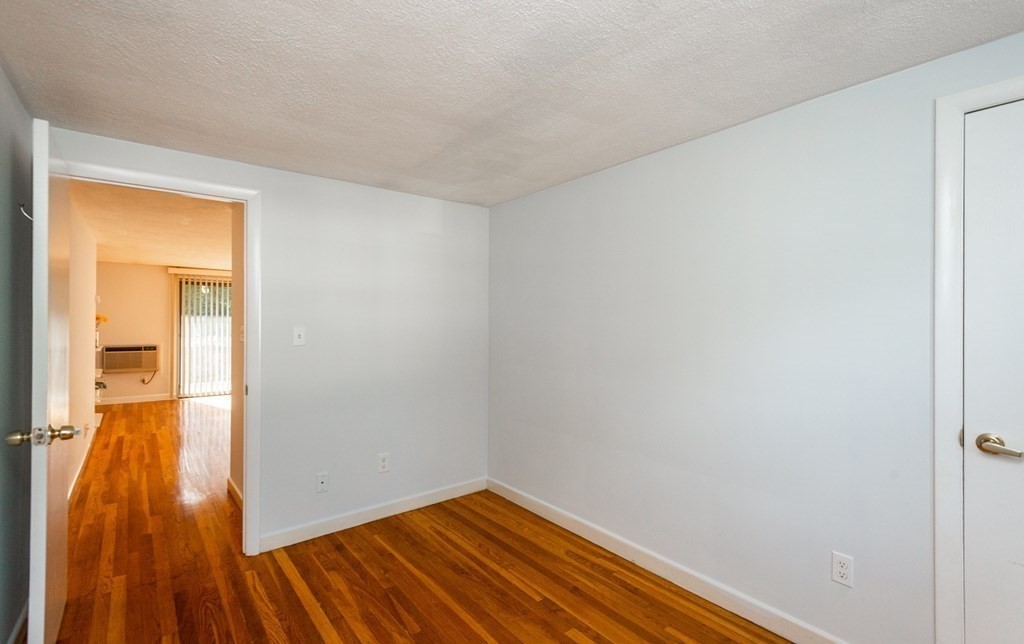 82 Renwick Road, Unit A Wakefield, MA 01880 - Photo 23 of 34 a view of hallway with wooden floor