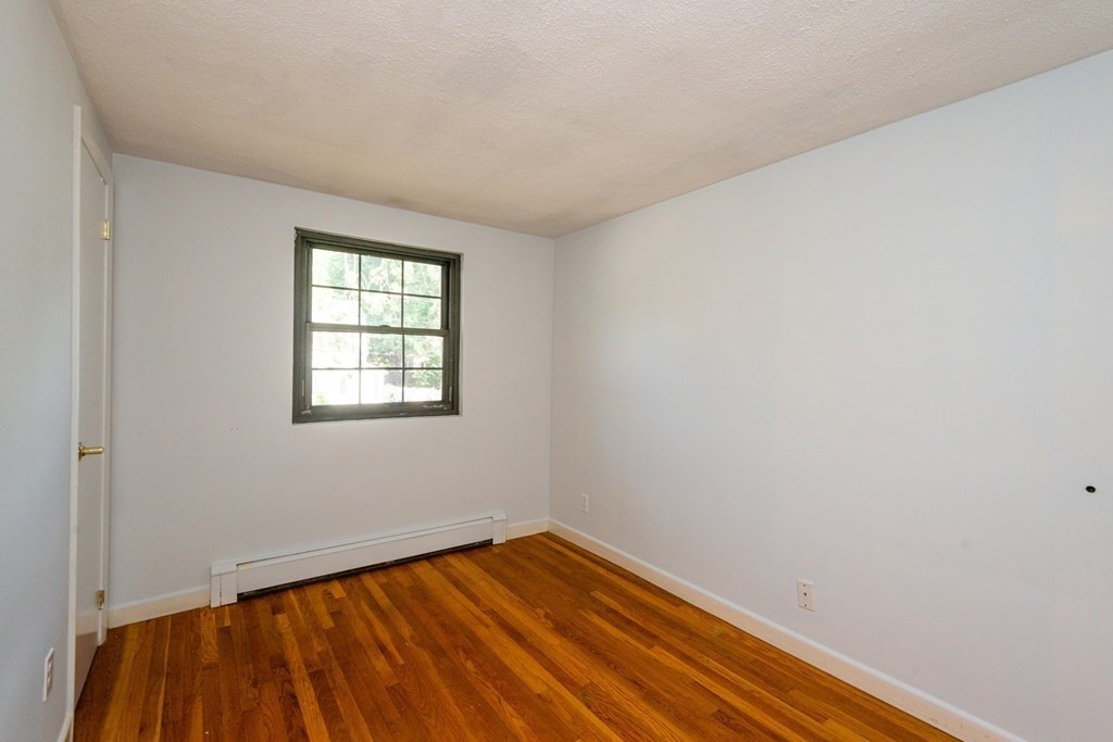 82 Renwick Road, Unit A Wakefield, MA 01880 - Photo 25 of 34 an empty room with a window