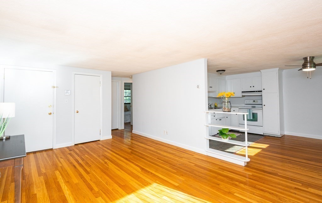 82 Renwick Road, Unit A Wakefield, MA 01880 - Photo 4 of 34 a room with a bed and a view of kitchen