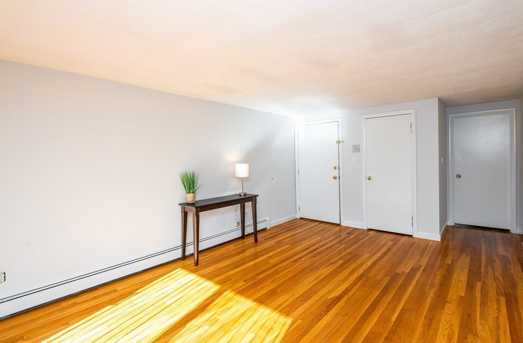 82 Renwick Road, Unit A Wakefield, MA 01880 - Photo 5 of 34 a view of a room with wooden floor and small space