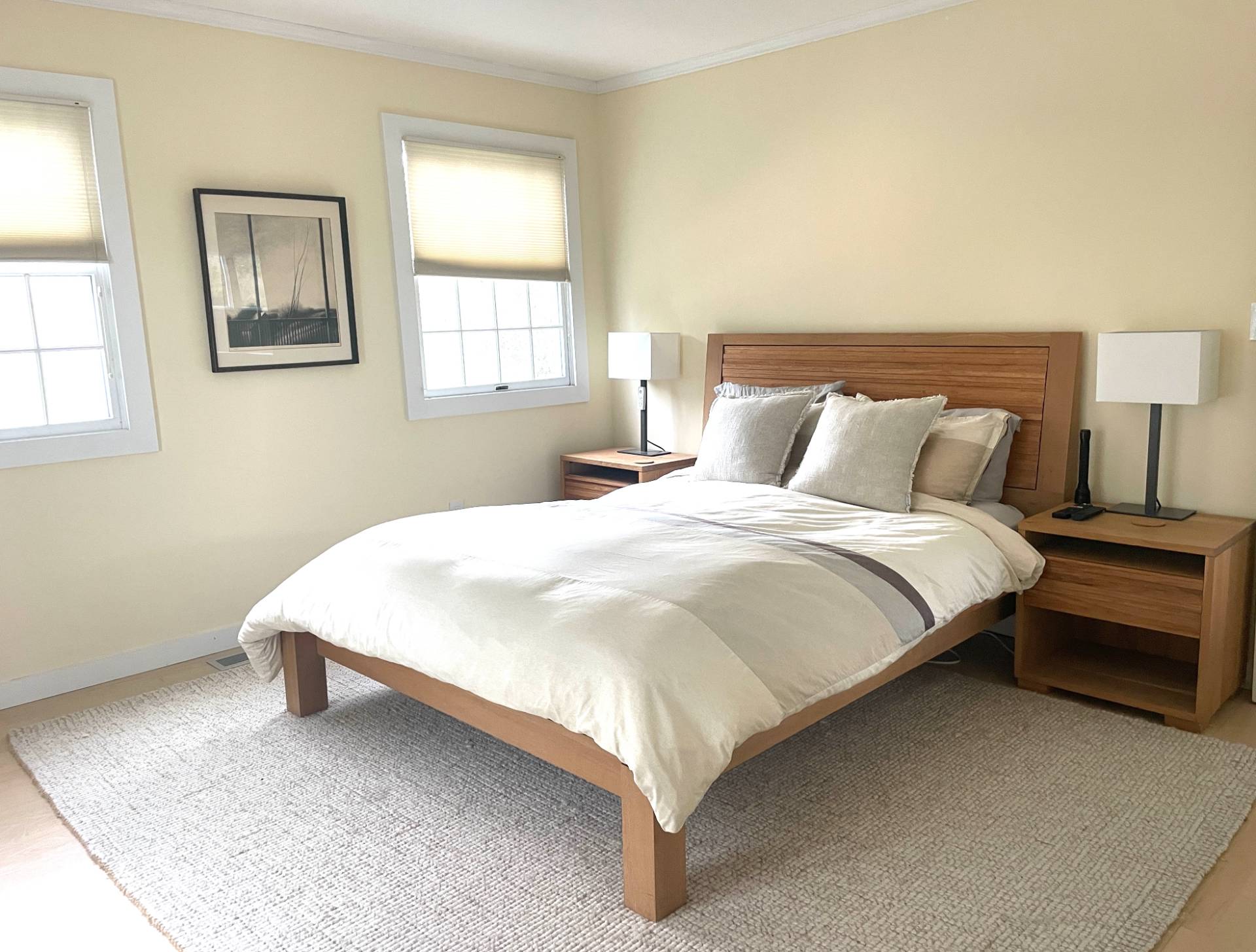 761 North Sea Mecox Road Southampton, NY 11968 - Photo 13 of 22 a large bed sitting in a bedroom next to a window