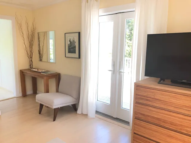 a view of balcony with wooden floor and fence