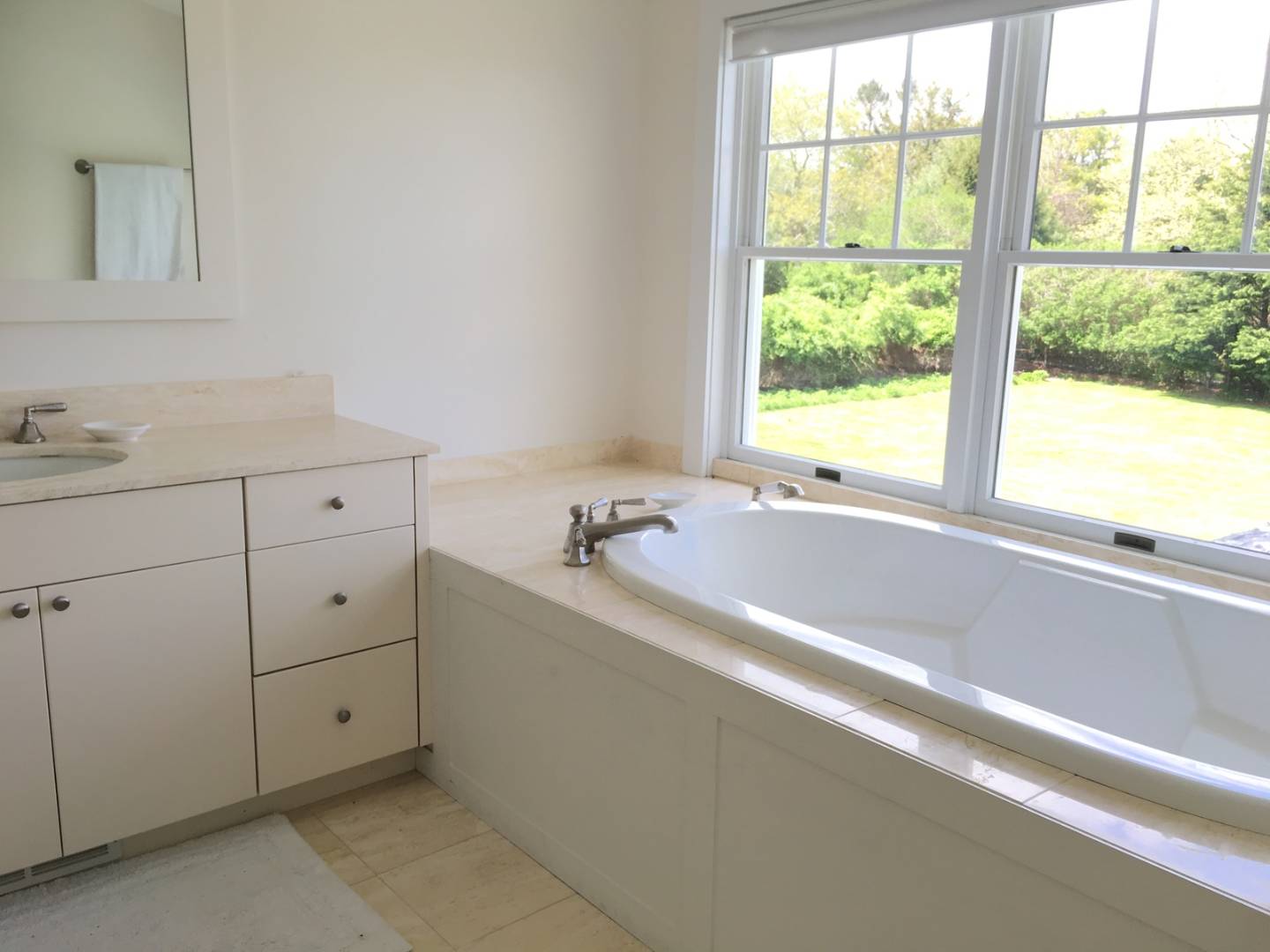 761 North Sea Mecox Road Southampton, NY 11968 - Photo 16 of 22 a view of a bathroom with bathtub and window